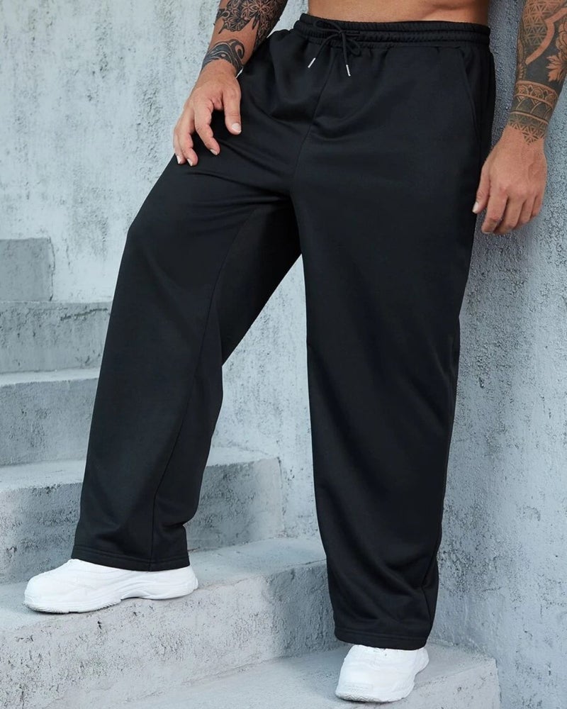 فلاينوف بنطلون رياضي رجالي أسود سادة بقصة فضفاضة - Image 1